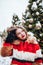 Younggirl on the red Square through winter holiday in Moscow, stylish and beautiful posing near to Christmas tree