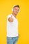 Because your ears deserve the best. Handsome man give thumbs up yellow background. Headphones technology. Approval sign