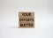 Your Effort Matter symbol. Wooden blocks with words Your Effort Matter. Beautiful white background. Business and Your Effort