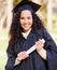 Your efforts will measure up to greatness. Portrait of a young woman holding her diploma on graduation day.