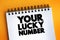 Your Lucky Number text on notepad, concept background