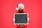 For your New Year greetings. Santa welcomes you to New Year eve party. Bearded man hold empty blackboard. Merry