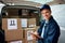 Your package is safe and on its way. a handsome young delivery man using a clipboard.