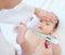 Youre a bit warm sweetheart. a paediatrician examining a baby in a clinic.