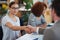 Youre doing amazingly well. a two colleagues shaking hands while sitting in an office.