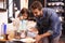 Youre doing great sweetheart. A cute little girl helping her dad make pancakes at home.