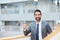 Youre doing some excellent work. Portrait of a young businessman showing thumbs up in an office.