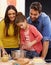 Youre doing so well. a happy family baking together in the kitchen.