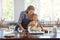 Youre doing so well. a mother and her daughter baking in the kitchen.