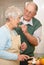 Youre going to enjoy this. a senior couple cooking dinner in the kitchen together.