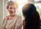 Youre in good hands. a smiling senior woman talking with a nurse in assisted living facility.