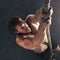 Youre making great progress towards your goals. a muscular young man climbing a rope in a gym.