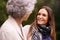 Youre never too old for some motherly advice...an attractive woman spending time with her senior mother outdoors.