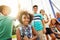 Youre welcome to hangout with us on the swings. Portrait of a group of young children playing together at the park.