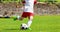 Youth Football Soccer Player Hits a Ball. Footballer Kicking Ball