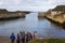 A youth group receives instructions from the group leader before taking part in water sports at the harbor in Ballintoy on the Nor