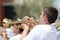 Youth plays horn in parade in small town America