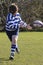 A youth rugby player passing a rugby ball !!