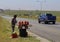 Youth selling mangoes to passing motorists