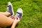 Youth sneakers on girl legs on grass