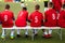 Youth Sport Soccer Team Sitting on Bench. Young Footballers