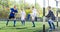 Youthful football players challenging for ball