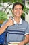 Youthful Minority Boy Student With Thumbs Up With Books