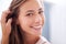 Youthful radiance. A young woman smiling at the camera - closeup.