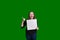 Youthful women giving a thumbs up holding a blank white board excited expression on green screen background