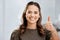 Youve got my approval. Cropped portrait of an attractive young businesswoman giving thumbs up while standing in the