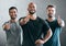 Youve got our support. Cropped portrait of three handsome young male athletes giving thumbs up towards the camera