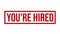 Youâ€™re Hired Rubber Grunge Stamp Seal Vector Illustration