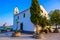 Ypapanti Church - Beautiful scenery at sunset in Gouvia Bay â€“ small ancient white church on a pier, Corfu island, Ionian sea,