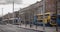 Ypical Irish double decker bus running and an electric tram  in Dublin