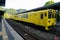 Yufuin, Japan - May 13, 2017 :Yellow color vintage train diesel car of JR Kyushu Railway Company stopped on rail at train station