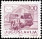 YUGOSLAVIA - CIRCA 1986: A stamp printed in Yugoslavia from the `Postal Services` issue shows Postman and van, circa 1986.