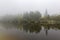 Yugra, a misty morning on the bank of the taiga river