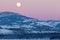 Yukon Canada winter landscape and full moon rising