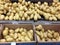 Yukon Gold potatoes in bin at grocery store