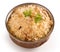 Yummy delicious biryani in a round brass bowl isolated
