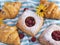 Yummy freshly croissants, cake tart puff pastry with raspberries, view from above