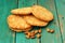 Yummy homemade almond cookies with whole almonds on turquoise sh