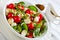 Yummy pea salad with grape tomatoes on a plate