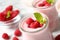 Yummy raspberry smoothie in glass jar on table, closeup