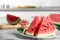 Yummy watermelon slices on white marble table