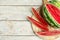 Yummy watermelon on white wooden table, top view. Space for text