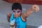 Yungay, Peru, August 4, 2014: portrait of indigenous features latin boy with blue diy mask making superhero victory gesture