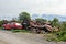 Yunk metal jardat the forest. metal trash. Huge pile of scrap metal with cloudy sky background