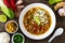 Yunnan rice noodle soup on wooden table