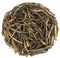 Yunnan wild arbor chinese black tea in round shape isolated